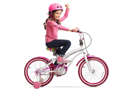 Little girl with a bicycle gesturing with her hand