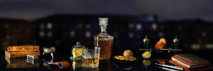 Panorama still life with whiskey and antique objects