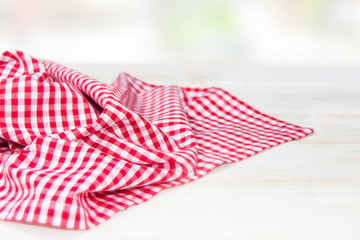 The checkered tablecloth on a table