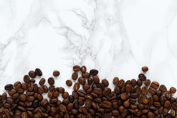 Roasted coffe bean on marble foil background