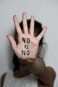 woman with the text no is no written in her palm