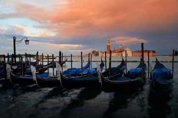 Fototapeta na wymiar Gondola and San Giorgio Maggiore island sunrise