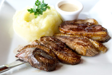 juicy steak veal beef meat with tomato and potatoes