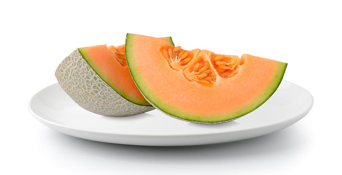 cantaloupe melon in plate isolated on a white background