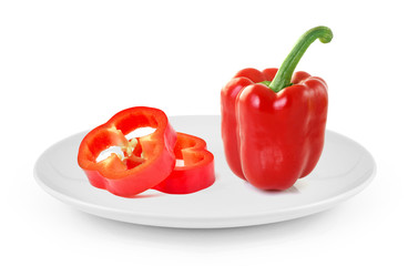 red sweet pepper in plate isolated on white background