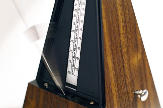 Metronome in action isolated and on a plain background