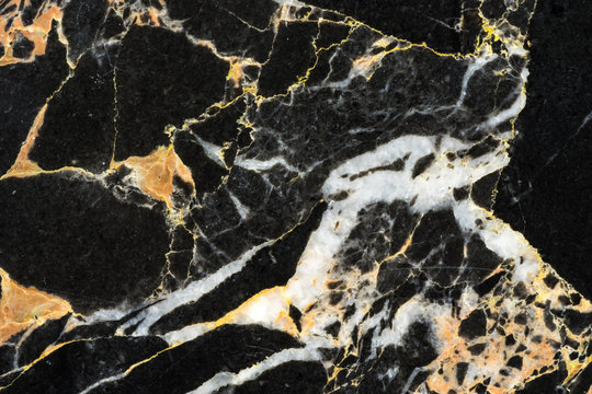 golden black marble with abstract texture pattern