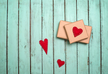 Valentines background with gift box and hearts on on shabby chic wooden background with copyspace. Place for text. Top view with copy space.