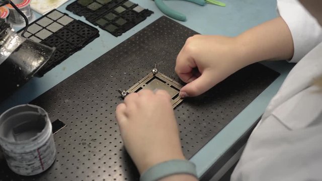 Manufacture of microchips. Remove the stencil and extract the finished chip