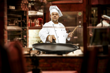 Cook chef in his own small business of restaurant.
