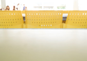 Empty tables and chairs that nobody sit in the cafeteria