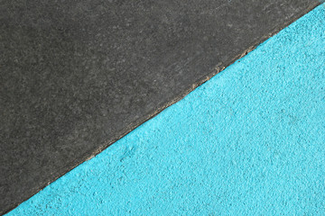 Blue and gray textured surface of asphalt for abstract background, top view.