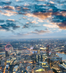 Obraz premium City skyline along river Thames at night, aerial view - London - UK
