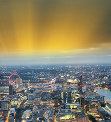 City skyline along river Thames at night, aerial view - London - UK