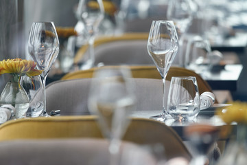 Row of glasses inside restaurant. Elegance and business concept