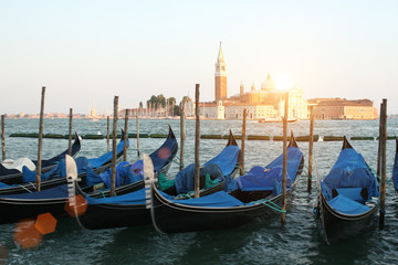 Obraz na płótnie Canvas Blue gondolas in Venice on the joke.