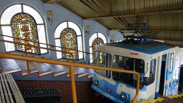 Ancient Kiev funicular 1905. Interior of the upper station with a trailer and colorful stained-glass windows.