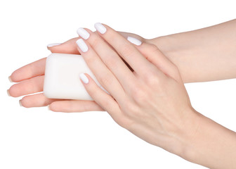 Soap in female hands isolated