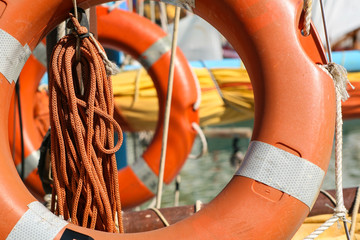 Orange lifebuoy on a yacht (ship)