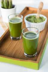 Wheatgrass shot glasses with powdered wheatgrass