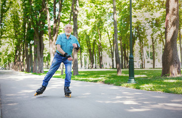 Senior man roller skating outdoors