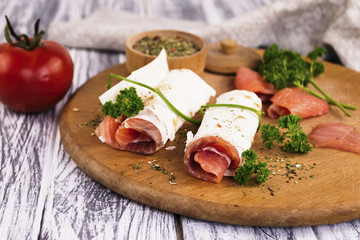 snack salted red fish and spices on the table