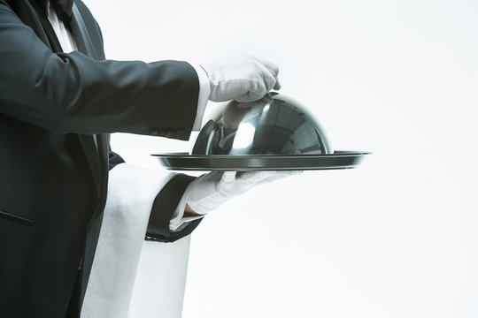 Close Up Waiter Hand With Tray And Metal Cloche Lid Cover