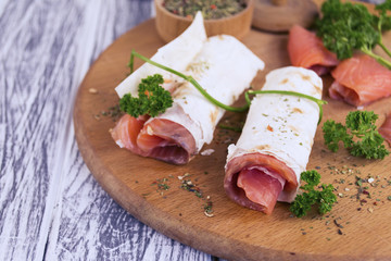 snack salted red fish and spices on the table