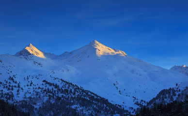 Fototapeta na wymiar Mont Vallon in ski area Les 3 Vallee in the last sunlight of the, France. 