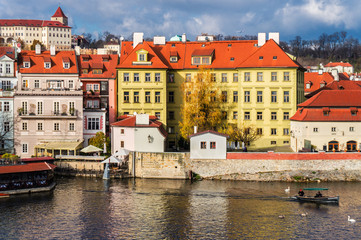 Fototapeta na wymiar Vltava river and the building of the Museum of Franz Kafka in Prague, Czech Republic.
