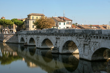Obraz premium Summer. Italy. Rimini. Bridge of Tiberius. Gulls on the bridge. Colorful