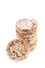 Round wheat crispbread, white background. Composition of crispbread on white background.