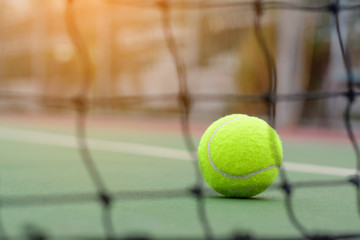 Blur net tennis on ball and court background