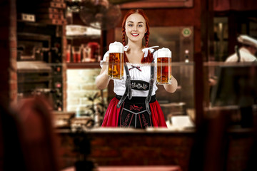 Young slim woman in bavarian clothes and her small business of bar 