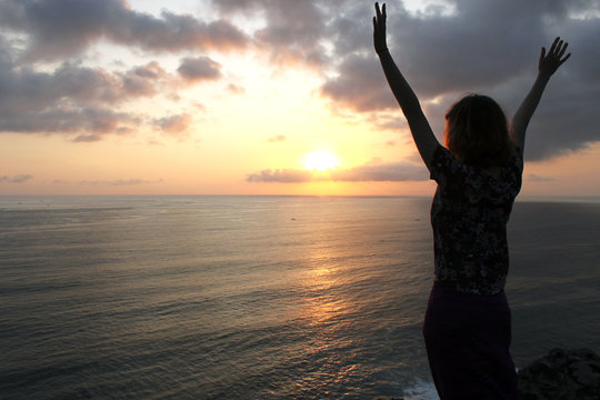 Silhouette of girl at sunset 