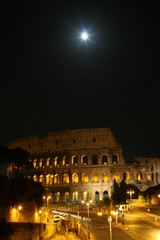 Fototapeta na wymiar Summer. Italy. Rome. Night Colosseum with illumination. The moon in the sky