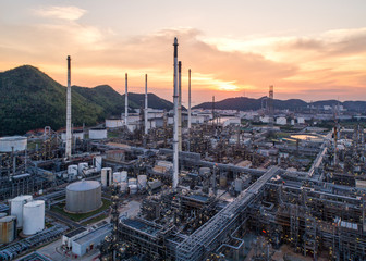 Aerial view Oil refinery.Industrial view at oil refinery plant form industry zone with sunrise and cloudy sky.Oil refinery and Petrochemical plant at dusk,Thailand. Oil refinery background sunset.