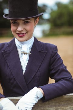 Smiling jockey posing for camera 