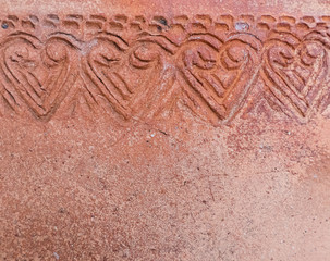 Flora pattern on the old pottery surface.
