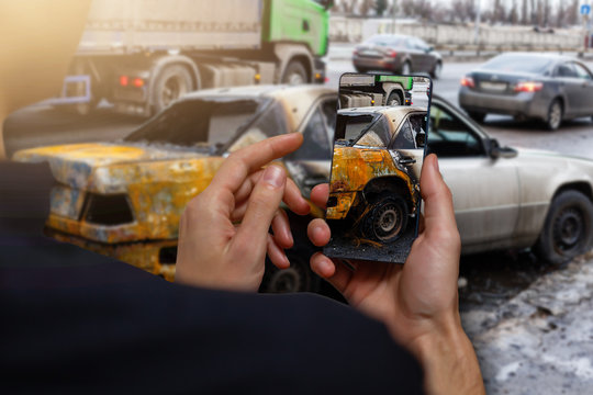 Car crash accident damaged with hand using smartphone taking