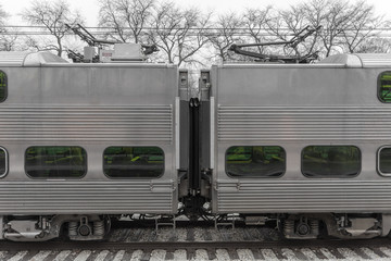 Between to train cars with bare trees