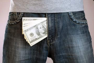 a bundle of dollar bills out of mens jeans like mens penis. Potency sexual problems and...