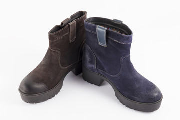 Female blue and brown leather boots on white background, isolated product, comfortable footwear.
