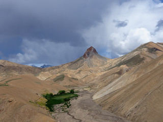 Views on high mountains from the route between the Srinagar city and the Leh city located in Ladakh. This region is a purpose of motorcycle expeditions organised by Indians
