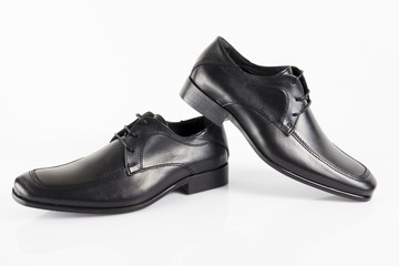 Male black leather elegant shoe on white background, isolated product, comfortable footwear.