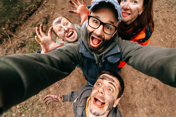 Four crazy funny people selfie. Bizarre scary company mess outdoor. Disgusting creepy fellows...