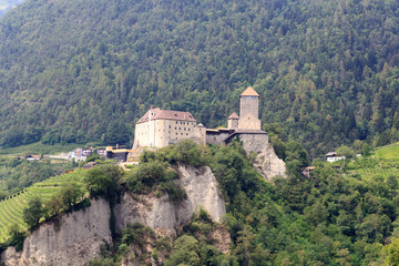 Fototapeta na wymiar Tyrol Castle and mountain panorama in Tirol, South Tyrol