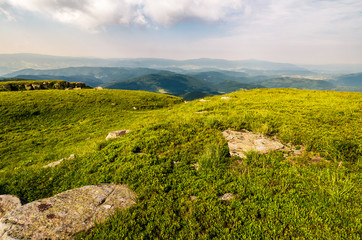 Fototapeta na wymiar grassy meadow on top of a hill. beautiful summer scenery in mountains