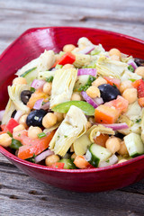 mixed Mediterranean salad bowl with artichoke and chick peas