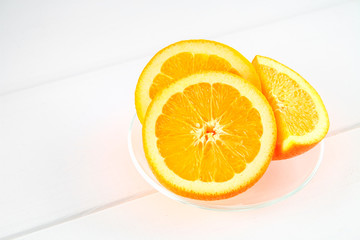 Orange slices on a white wooden table. Healthy food, drinks.